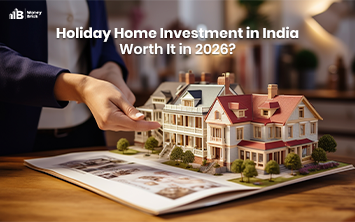 Holiday home investment in India with miniature luxury houses and property plans on a table.